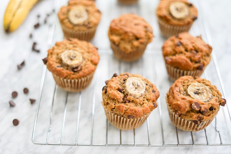 horizontal view of several muffins on a cooling rack