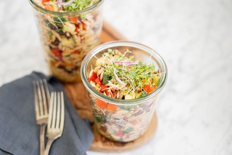 Orzo pasta salad in 2 lunch-size glass containers