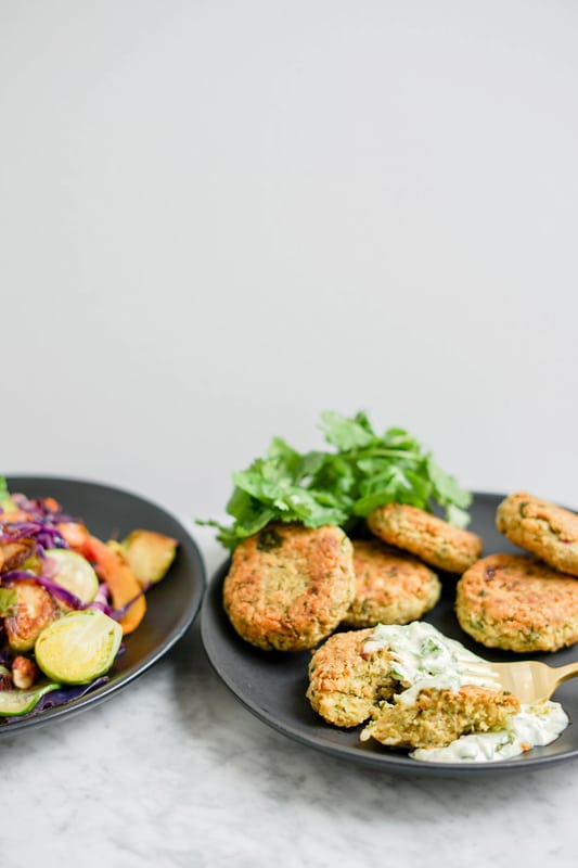 front view chickpea fritters and warm vegetable salad