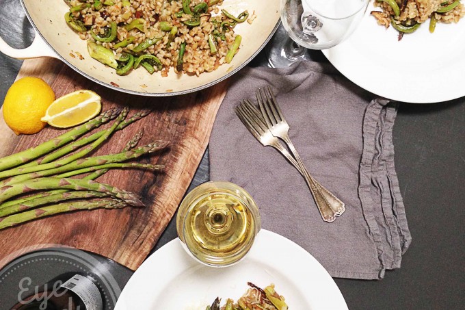 Vegan barley risotto with wild fiddleheads and asparagus