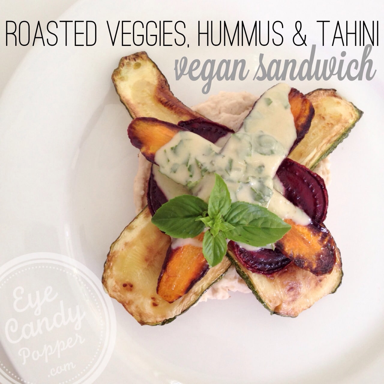 Roasted veggie sandwich with hummus and tahini dressing (vegan)