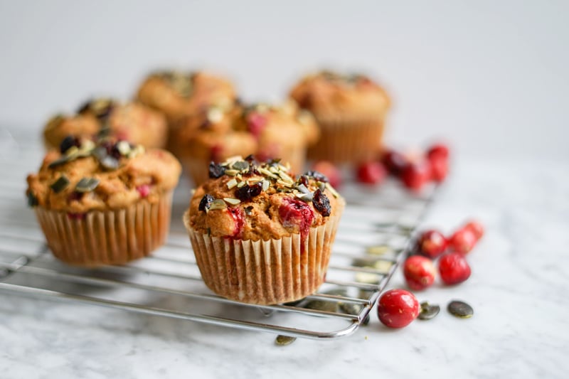 eye-level close-up view of pumpkin cranberry muffins